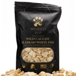 Freeze-dried fish treat pouch with gold paw logo and clear window of chunks