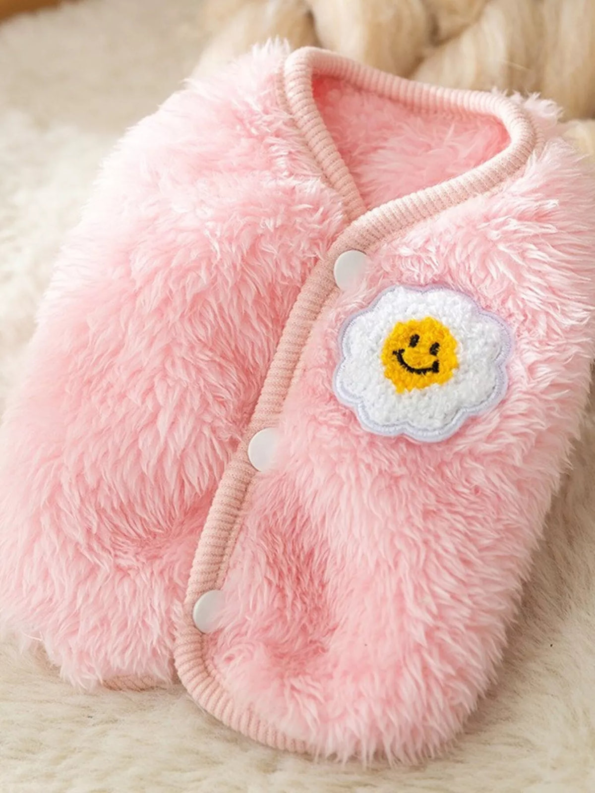 Pink plush pet sweater with cloud smile patch and snap-button closure