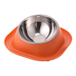 Orange tilted cat food bowl with stainless steel inner bowl