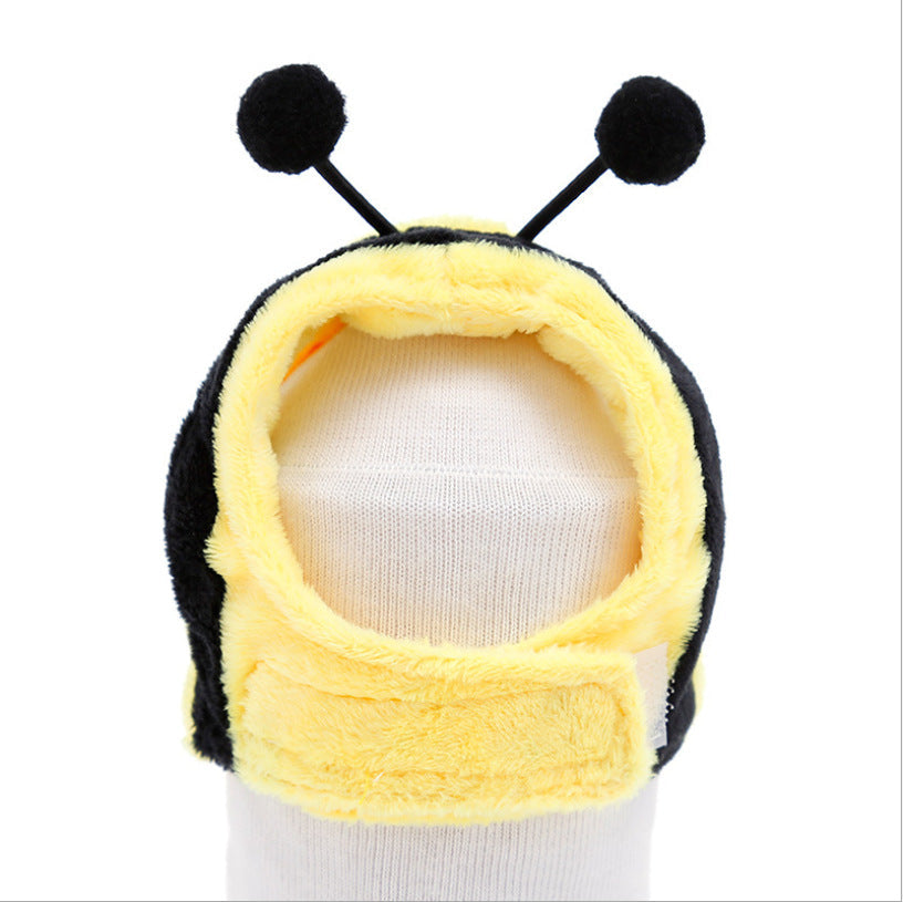 Bee plush pet hat with yellow-and-black body, round antennae, and hood