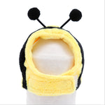 Bee plush pet hat with yellow-and-black body, round antennae, and hood
