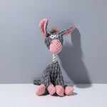 Plush squeaky bunny dog toy in dark gray with pink ears and light pink belly.