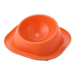 Orange tilted cat food bowl with raised interior ramp