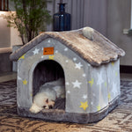 Light gray star-print pet house bed with front doorway and cushioned roof