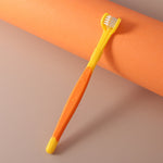 Yellow three-sided pet toothbrush with white base and bristled head