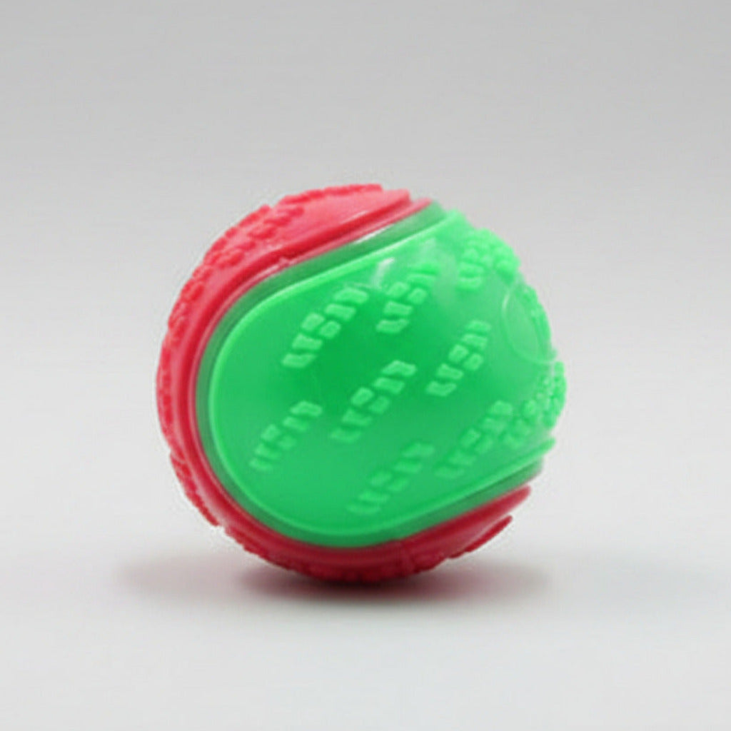 Dog training ball toy with green and red textured halves