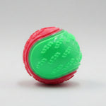 Dog training ball toy with green and red textured halves