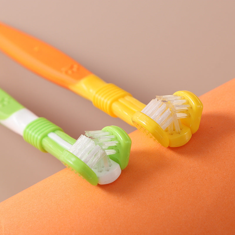 Close-up of three-sided pet toothbrush heads with orange, yellow, green, and white bristles