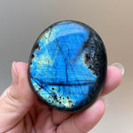 Labradorite ore specimen, large oval polished stone with strong blue labradorescence
