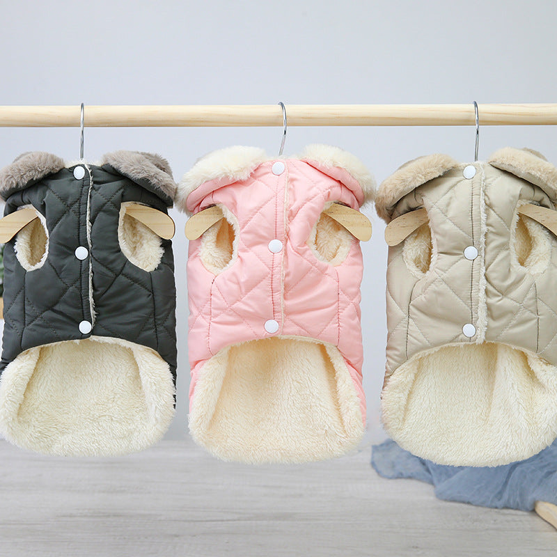Set of quilted dog coats on hangers: black, pink, and beige with plush lining