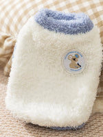 White plush pet sweater with light-blue trim and round bear patch badge