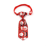 Red Christmas pet tie with snowman faces and striped patterns, clip-on strap