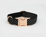Black polka-dot dog collar with rose-gold buckle and D-ring; smooth webbing