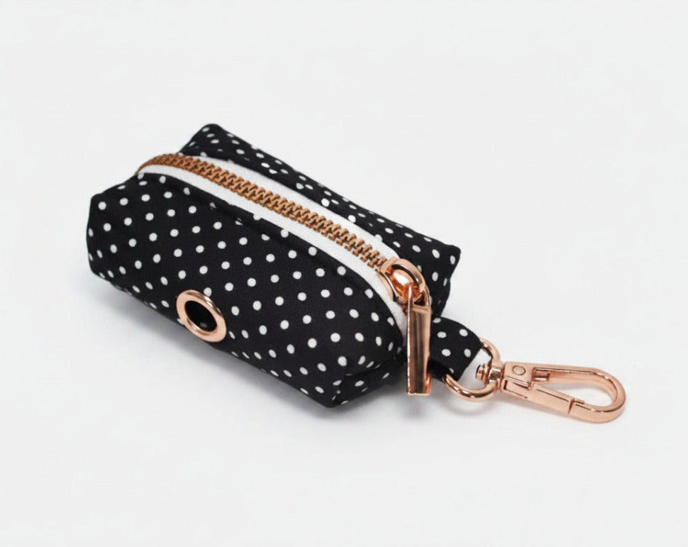 Black polka dot poop-bag holder with rose-gold clip and zipper