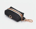 Black polka dot poop-bag holder with rose-gold clip and zipper