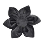 Black velvet flower accessory with layered petals and center knot
