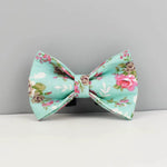 Teal floral bowtie with pink flowers and brown accents, centered knot