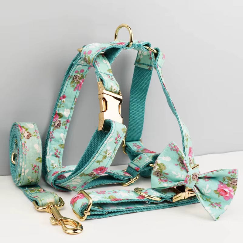 Floral teal dog harness with adjustable straps and matching leash clip