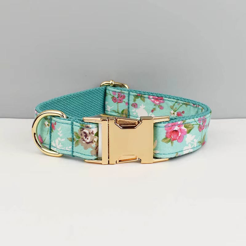 Teal floral dog collar with gold rectangular buckle and D-ring, bowtie details