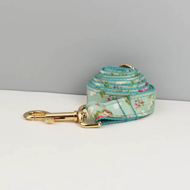 Floral teal dog leash with gold clasp and woven loop handle