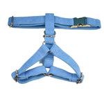 Blue corduroy harness with two leg straps and gold buckles, light-blue ribbed fabric.