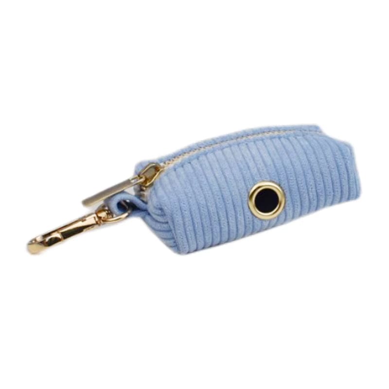 Light-blue corduroy waste bag pouch with gold ring and clasp, ribbed fabric.