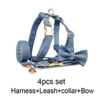 Blue denim dog harness with bow tie and matching leash with gold hardware