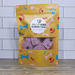 Freeze-dried blueberry yogurt dog treat bag with paw and bone graphics, front label