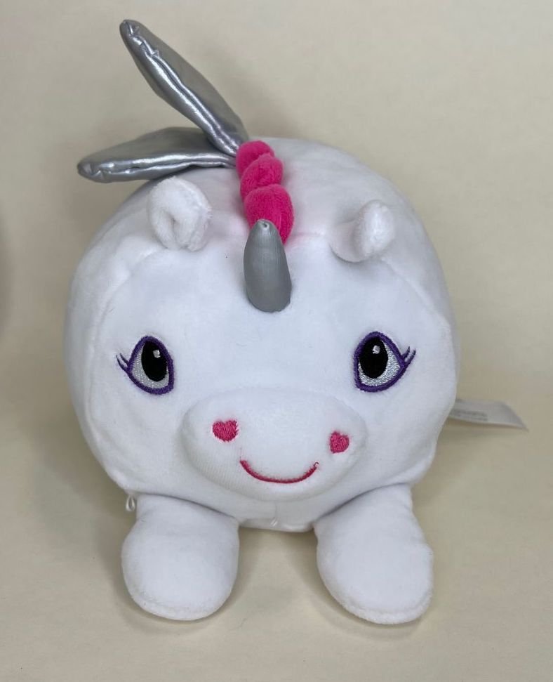 White unicorn plush squishy pet toy with purple eyes, pink cheeks, and silver horn