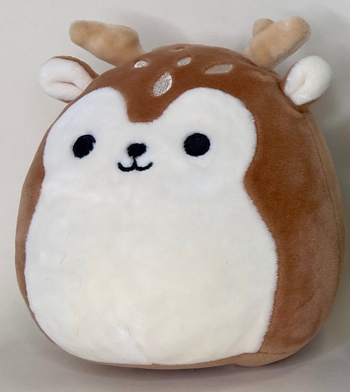 Brown-and-white plush hamster pet toy with round belly and small ear details