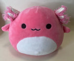 Large squishy plush pet toy, pink whale/cat with black eyes, white belly, and fuzzy fins.