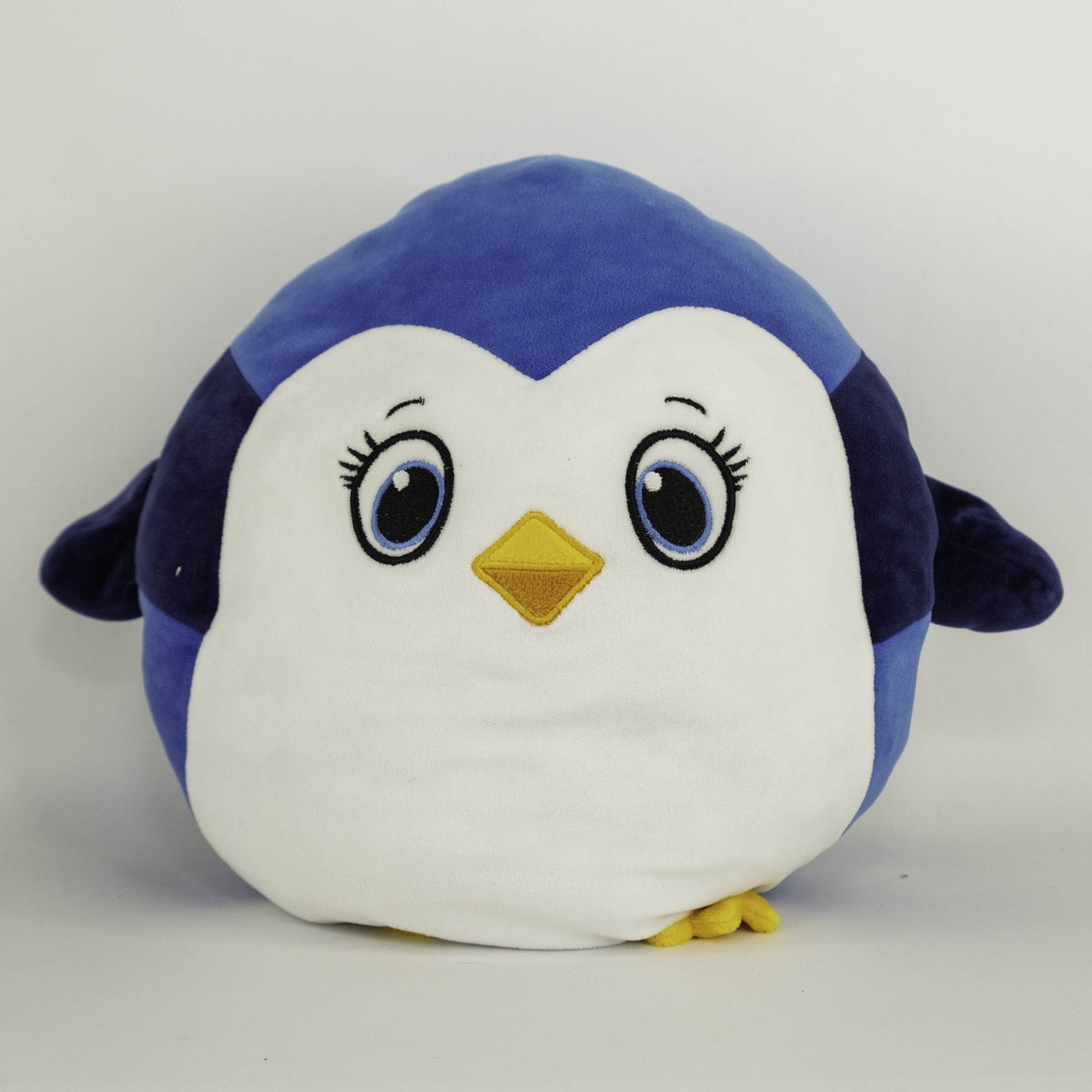 Large blue-and-white penguin plush pet toy with yellow beak and squishy body