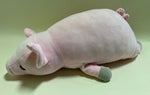 Sleeping pastel plush squishy pet toy with curled body and small pink paw details