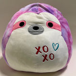 Pink and white sloth-style plush squishy pet toy with stitched “xo xo” heart details