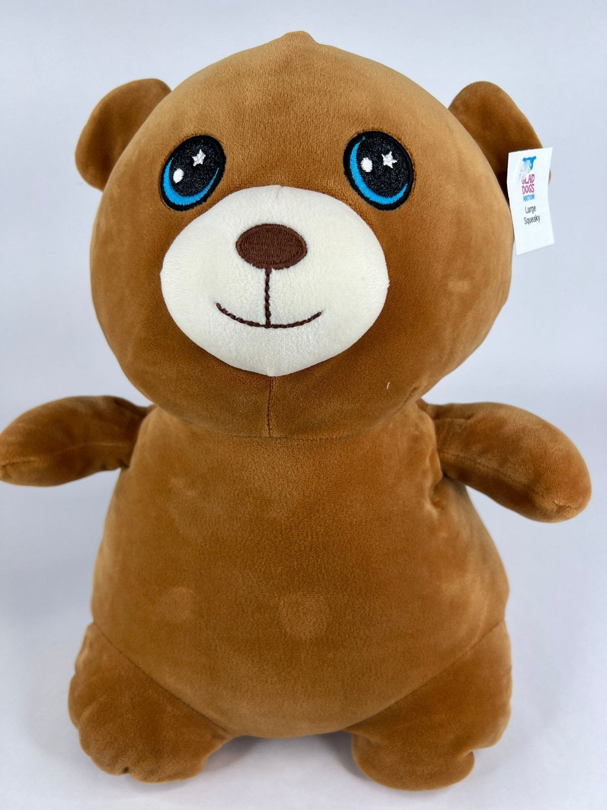 Large squishy plush pet toy, brown puppy with big blue eyes and white muzzle