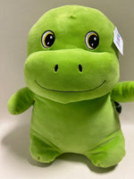 Green dinosaur-style plush squishy pet toy with big eyes and friendly stitched smile