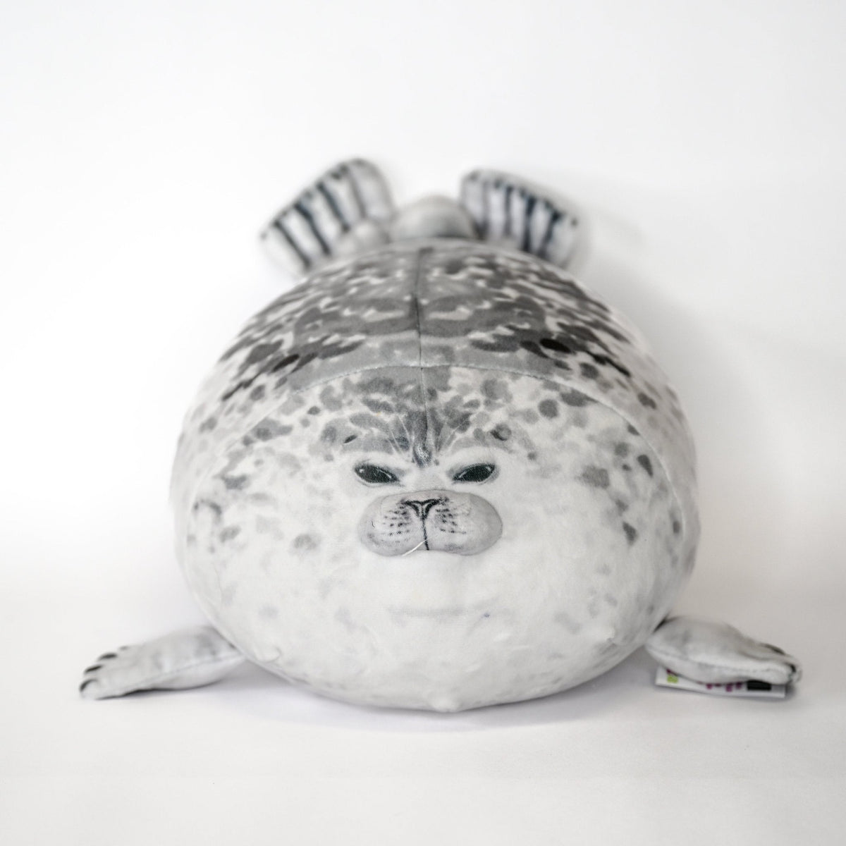 Gray-and-white seal plush cuddler with striped ears and stitched snout and whiskers