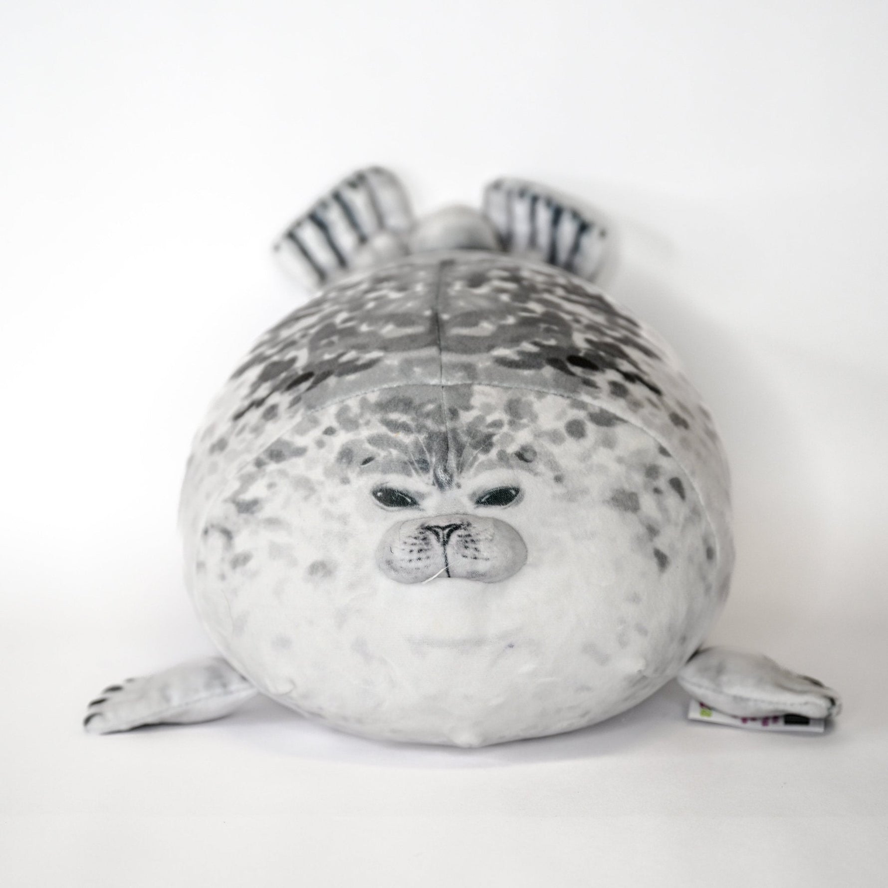 Gray-and-white seal plush cuddler with striped ears and stitched snout and whiskers