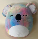 Large squishy plush pet toy, pastel tie-dye bear with closed eyes and big black nose.