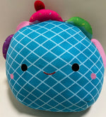 Blue waffle-pattern plush squishy pet toy with smiling face and small green leaf accents
