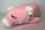 Pink plush pig cuddler with closed-eye smile, white paws, and soft rounded body