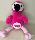 Pink plush flamingo pet toy with large black eye and “Dorney Park” badge