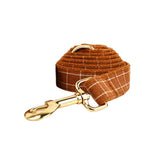 Brown plaid dog leash with gold clip and matching strap