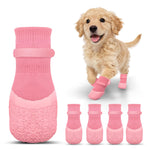 Pink anti-slip dog socks with textured paw-grip sole pattern and elastic cuffs.
