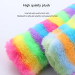 Close-up of rainbow plush stripes on a long cat pillow toy