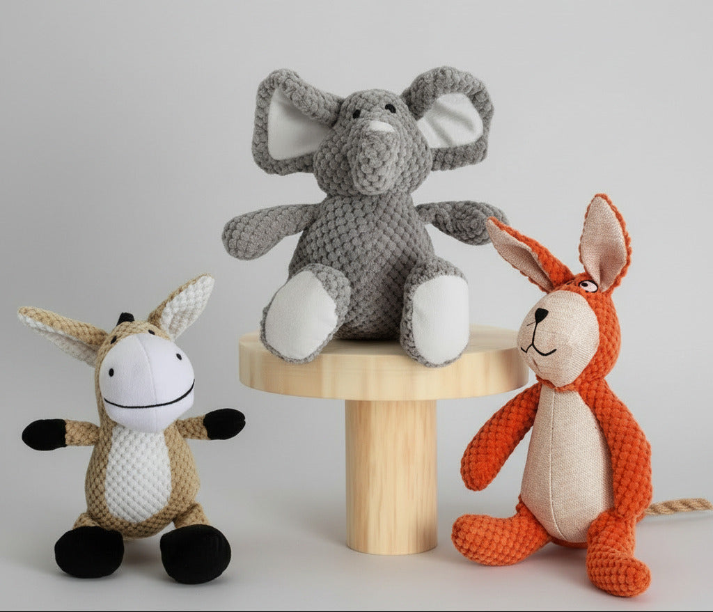 Gray elephant plush pet toy with large ears, textured knit fabric, and padded legs