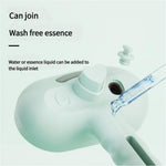 Pet steam brush with mint-green body, tank opening, and oval textured cleaning head