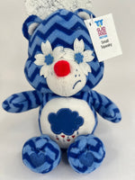 Upcycled plush dog toy, blue zigzag bear with white cloud belly and red nose, tag