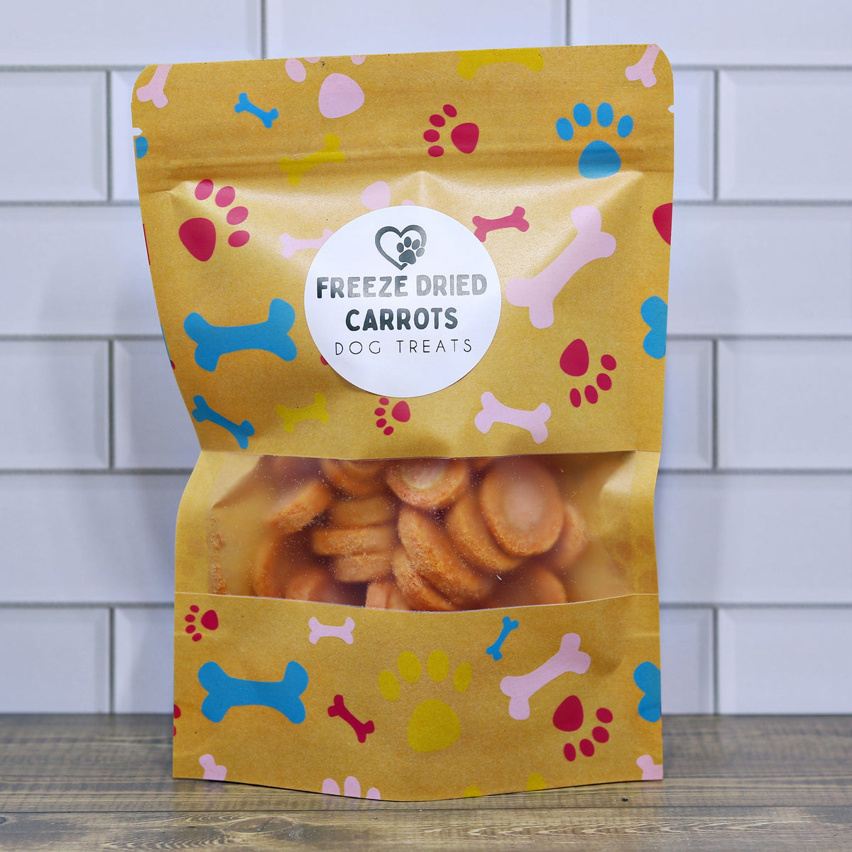 Freeze-dried carrot dog treat pouch with colorful paw print design