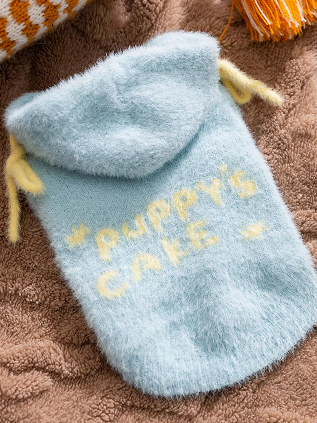 Light blue knitted pet sweater with yellow star knit pattern and hooded style